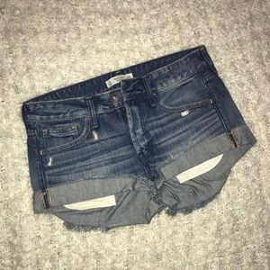 Distressed denim shorts